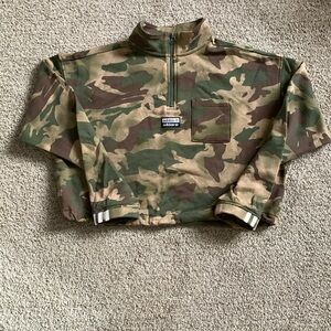 Here is a new women’s size XL adidas draw string crop sweatshirt